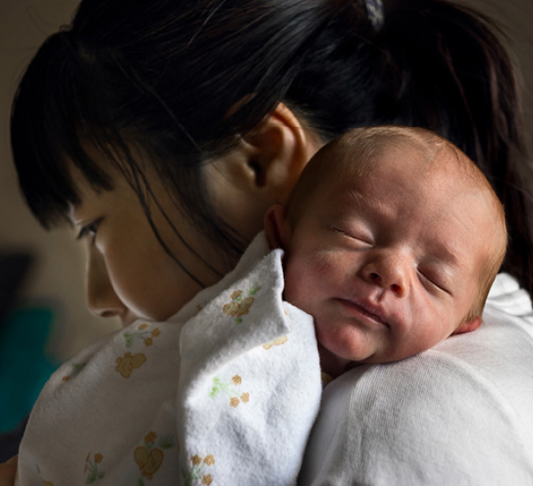 Newborn baby and mother after formula feeding.